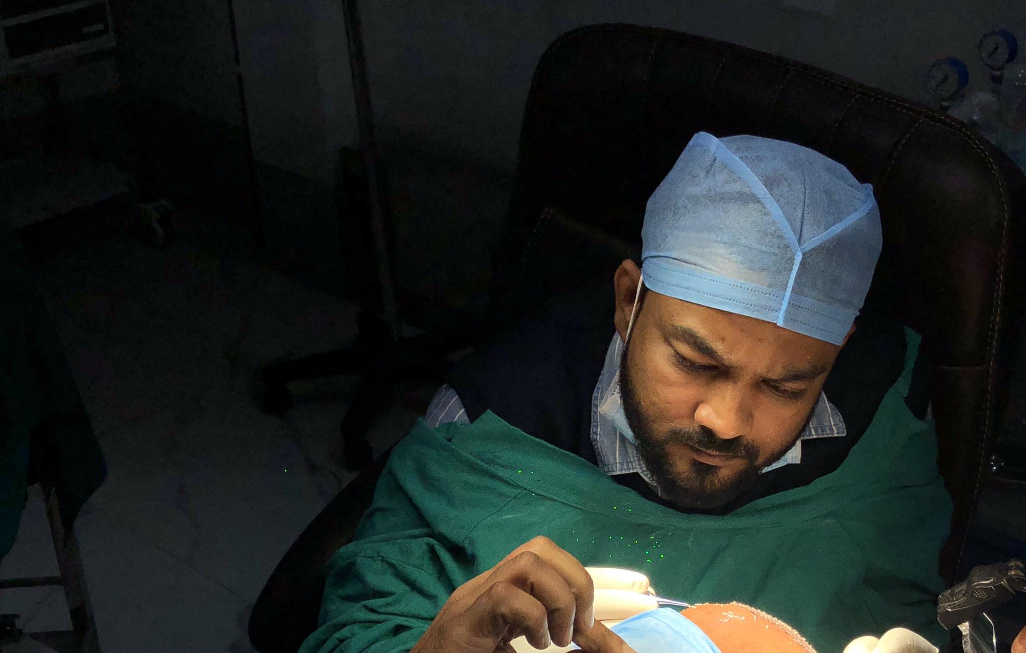 Dr. Khan performing surgery